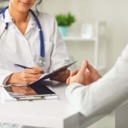 Depiction of a doctor speaking with a patient before a procedure.