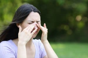 Woman experiencing nasal pressure